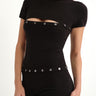 black shortsleeve knit romper with mother of pearl buttons at bust and waist