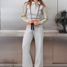 button-up heather grey fleece polo with green stripe detailing on sleeves