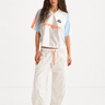 white adidas jersey and trackpant with orange stripes